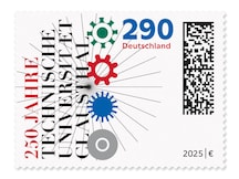 Schriftzug des Briefmarkenthemas mit strahlen und zahnradförmigen Symbolen.