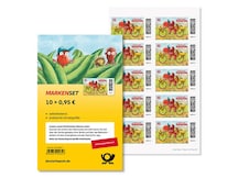 Der kleine Drache Kokosnuss mit seinen Freunden auf dem Postfahrrad